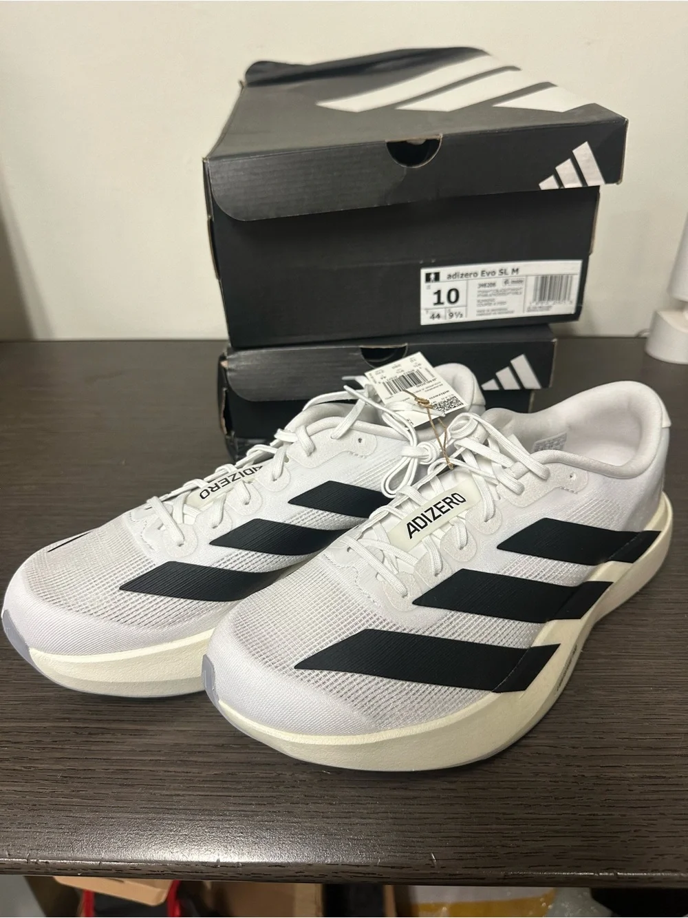 Brand New adidas Adizero Evo SL running shoes in Cloud White and Core Black.